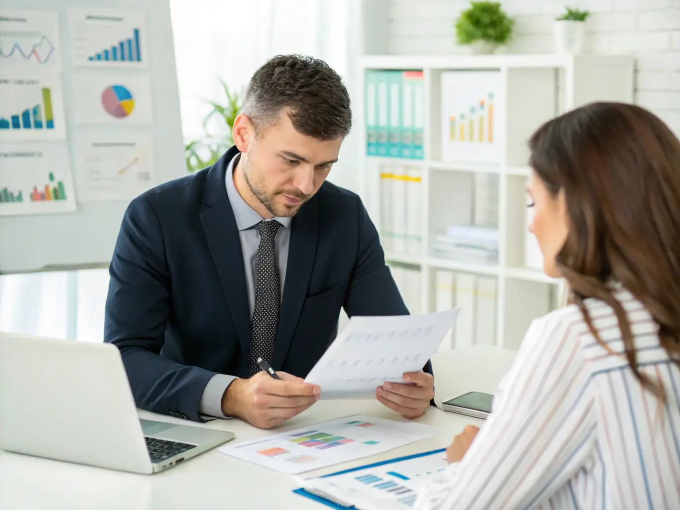 An accountant reviewing financial statements with a client in an office setting, discussing key findings and recommendations. The image emphasizes the importance of accurate and timely financial reporting.
